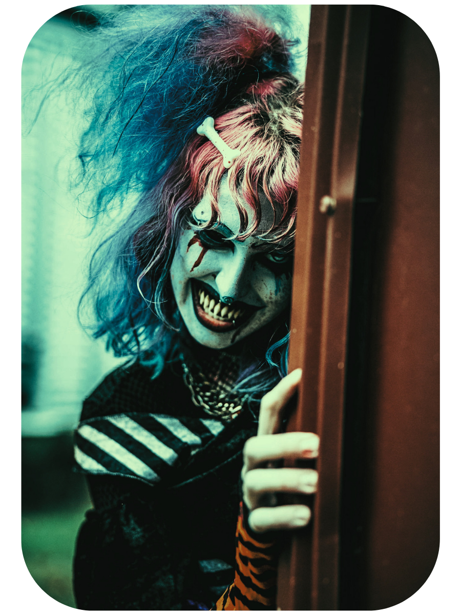 Tip Toes: a grinning clown-faced figure with teal and pink hair peering around a rust-red door.